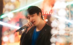 Jin comanda live e atinge meta de doações para Hana